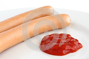 Two frankfurter sausages on a plate