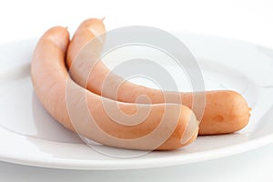 Two frankfurter sausages on a plate