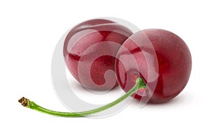 Two fresh cherries isolated on white background