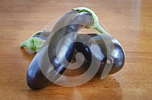Two fresh eggplants on the table