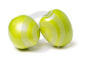 Two fresh jujubes on white. It also called the Chinese green jujube,it is produced in China Taiwan