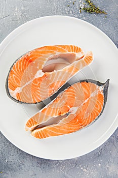 Two fresh raw salmon steaks