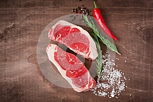 Two fresh raw sirloin steak on wooden Board