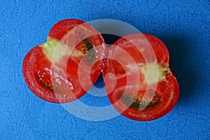 Two fresh red pieces of tomato