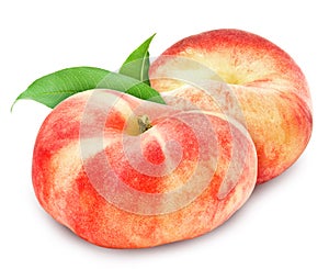 Two fresh ripe peach with leaf.