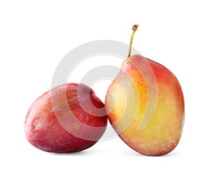 Two fresh ripe plums isolated on white