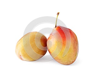 Two fresh ripe plums isolated on white