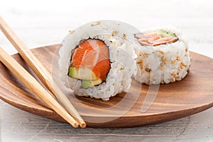 Two fresh salmon and avocado sushi uramaki photo
