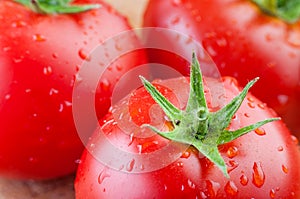 Two fresh tomatoes with water drops