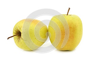 Two whole fresh yellow apples