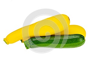 Two fresh yellow and one green courgette isolated on white background. Concept health. Closeup.