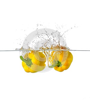 Two Fresh Yellow Paprika Splash in Water