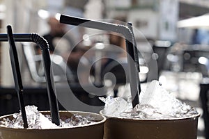 Two freshen drinks with straws