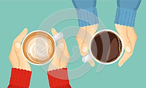 Two friends are drinking coffee. Hands hold cup of cappuccino or hot tea. Top view.