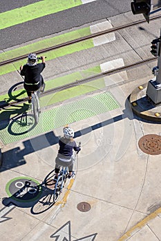 Two friends lead a healthy lifestyle practicing cycling on bicycles