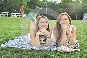 Two friends lying on the lawn