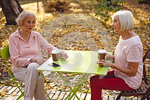 Two friends meeting over a cup of coffee