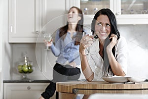 Two friends relaxing in the kitchen