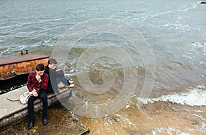 Two friends relaxing on the pier.