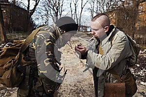 Two friends sharing smoke and getting ready to start fighting