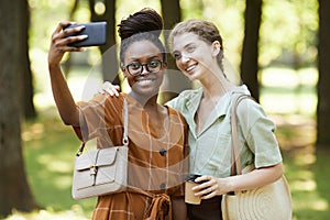 Two Friends Taking Photo in Park