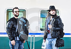 Two friends are waiting for the train to come