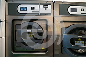 Two front-load washers at a public launderette