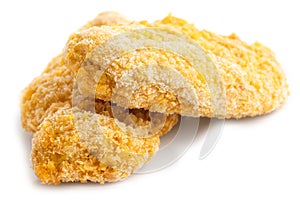 Two frozen bread crumbed chicken strips. photo