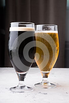 Dark and light beer glasses on a table