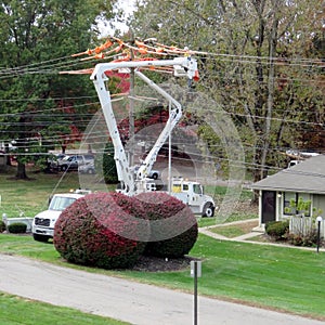 Two Fully Extended Cherry-Pickers Repairing Utility Lines