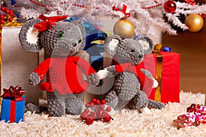 Two funny plush mice under the Christmas tree