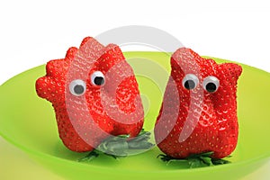 Two funny strawberries with jiggle eyes