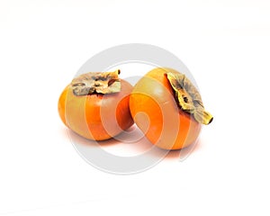 Two Fuyu persimmon isolated