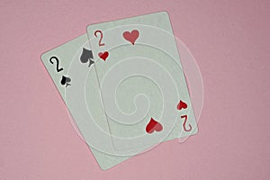 Two game cards with deuces