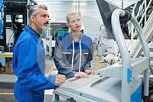 two garage mechanic working