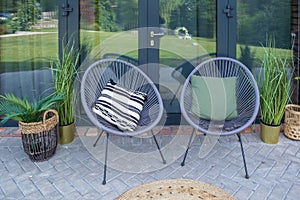 two garden chairs on the summer terrace.