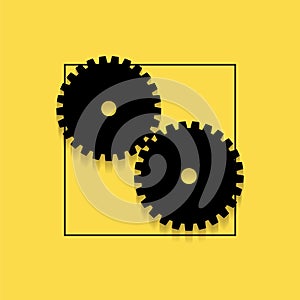 Two gears on a yellow background.