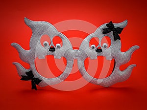 Two ghosts on a red background