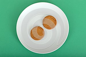 Two Ginger Nut Biscuits on a Plate