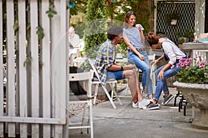 Two girl with Afro-American guy having fun