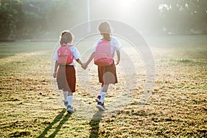 two girl friend primary school student walking together