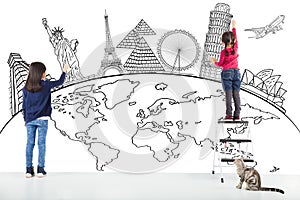 Two girl kids drawing global map and famous landmark