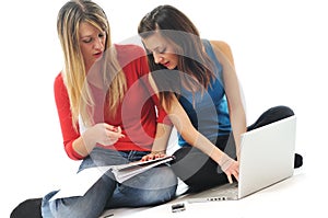 Two girl work on laptop