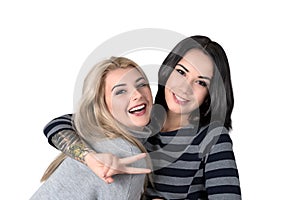 Two girlfriend blonde and brunette laugh