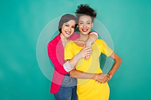 Two girlfriends having fun at azur studio background