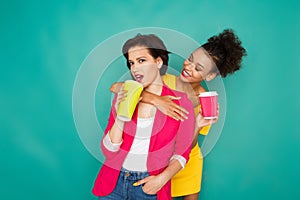 Two girlfriends having fun at azur studio background