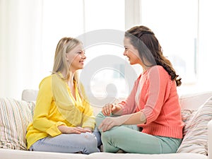 Two girlfriends having a talk at home