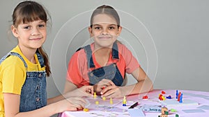 Two girlfriends at home playing board games did not share the chips