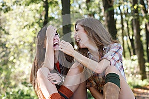 Two girlfriends outdoor laughing