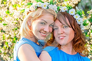 Two girlfriends with wreaths on the head